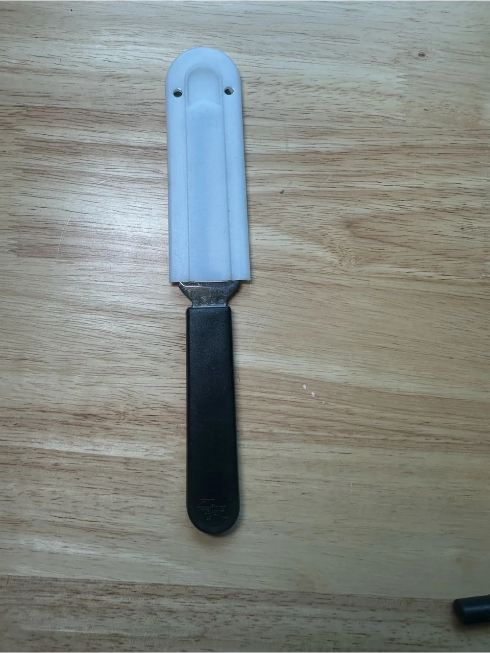 The Pampered Chef Cheese Plane with Black Handle and White Sheath #1125
